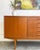 Now available! Beautifully crafted in the late 1950s, this teak sideboard embodies clean lines and timeless design. It...
