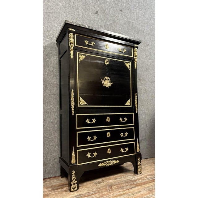 Early 19th century Boulle-style secretary desk in black lacquered wood and gilt bronze mounts Front opening with four...