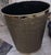 Vintage wastebasket featuring a quilted vinyl texture and brass plated trim. Oval shape with a textured vinyl quilted...