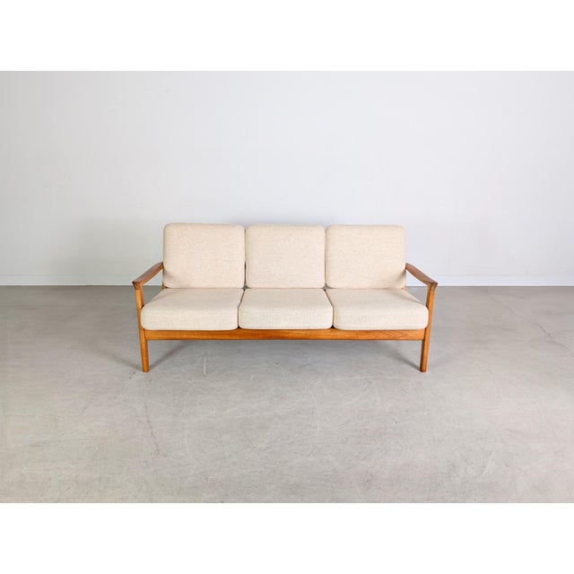 We are offering a beautiful three-seater sofa from the traditional Danish manufacturer France & Son, dating from the...