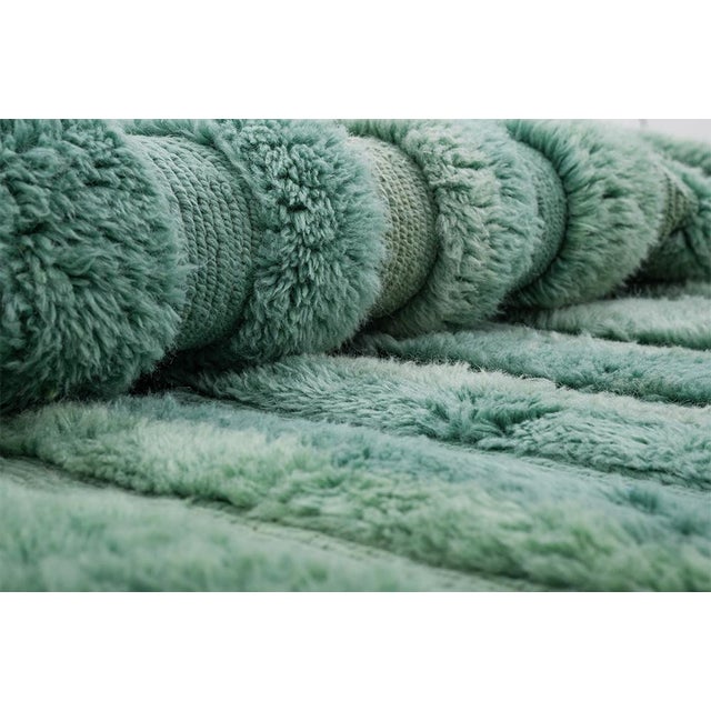A gradient that flows from forest to sea foam. Deep emerald green fades gracefully into soft teal and mint tones across...