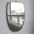 Mid-Century Italian wall mirror with brass frame (circa 1960s). This mirror is simply elegant and characterful in a...