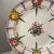 A vintage hand-painted floral faience wall plate, made by Zell. Features raspberry pink, orange, and indigo flowers with...