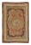This antique 3x5 hooked rug, circa 1920–1929, features a restrained floral medallion visual juxtaposition in warm earth...