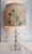 This is not an acrylic lamp. It is glass . The shabby chic lamp and shade are sweet together. Sort of romantic Victorian...