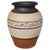 A tall circular rustic hand-thrown ginger jar, planter, or vase in black, brown, and cream. The vase is created from a...