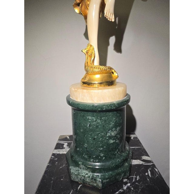 20th-century chryselephantine sculpture by j.r. Colinet elegant chryselephantine sculpture crafted in gilded bronze and...