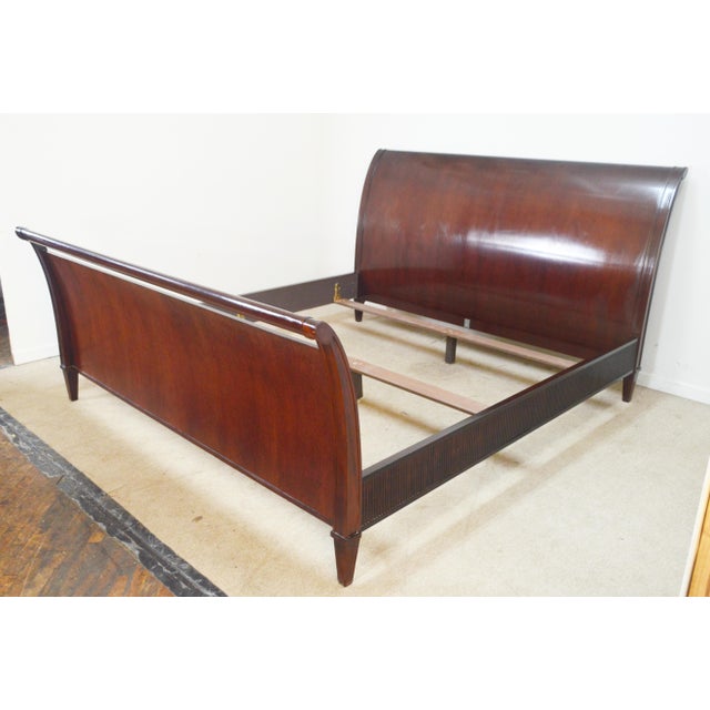 King Sleigh Bed by Baker. Store item # 503. It features solid wood construction , reeded sides and comes with slats.