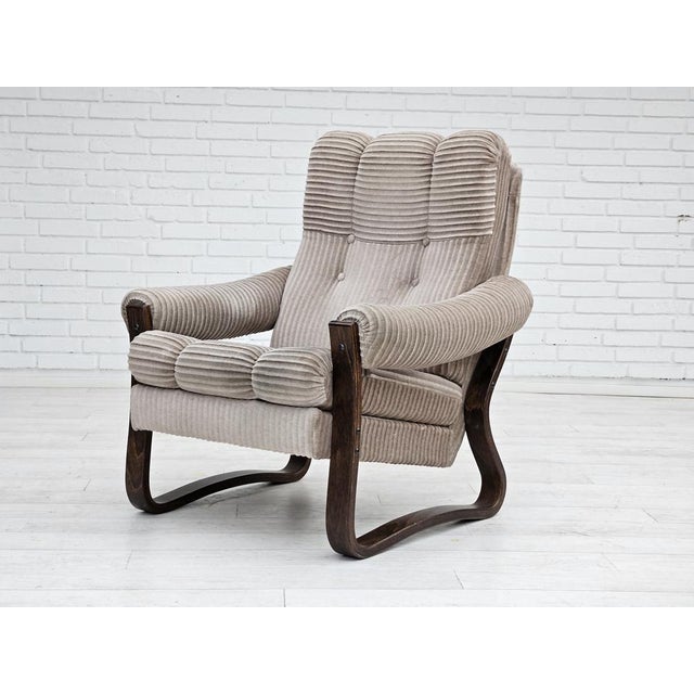 1970s, Danish lounge chair in original very good condition: no smells and no stains. Light brown furniture fabric, beech...