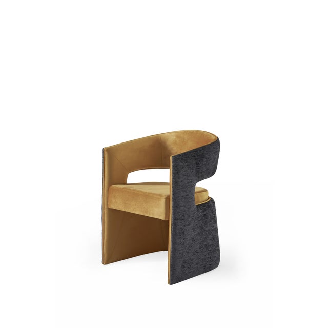 The Lina Dining Chair is a celebration of bold contrast and contemporary luxury. Its dynamic composition pairs rich golden...