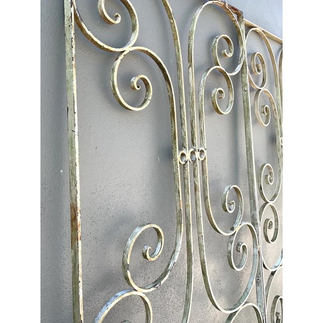 Crafted in solid wrought iron, this striking pair of mid-20th-century decorative panels showcases an airy yet sculptural...