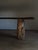 The Mata bench combines a blackened oak top with two solid chestnut legs, harvested from the forest. The wood is...