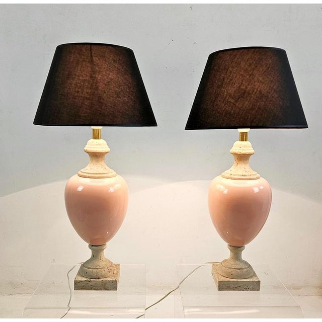 A refined pair of vintage table lamps from the 1980s, combining solid travertine bases with softly glazed pink ceramic...