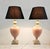 A refined pair of vintage table lamps from the 1980s, combining solid travertine bases with softly glazed pink ceramic...