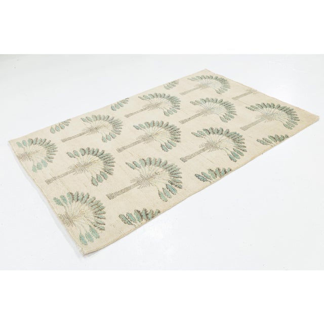 Bring a touch of coastal elegance and vintage flair to your space with this 4x6 modern Art Deco style wool rug. Featuring...