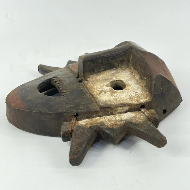 This marvelously expressive mask could be a recent example of a well-known mask type from the Boa people who live in the...