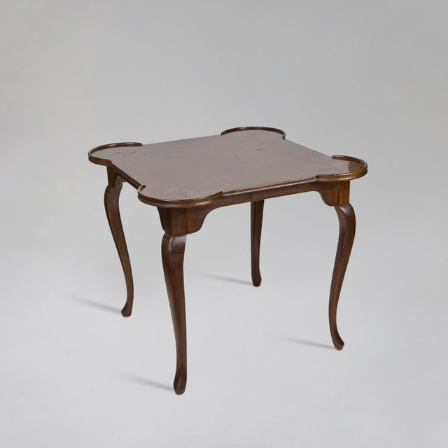 This vintage Queen Anne game table was beautifully crafted in Italy with a rich, warm wood finish and a gracefully shaped...