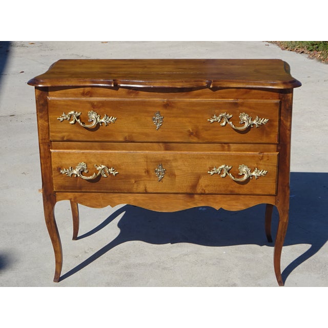 Charming small Louis XV style chest of drawers with two drawers. The solid cherry wood top has an oak-colored finish with...