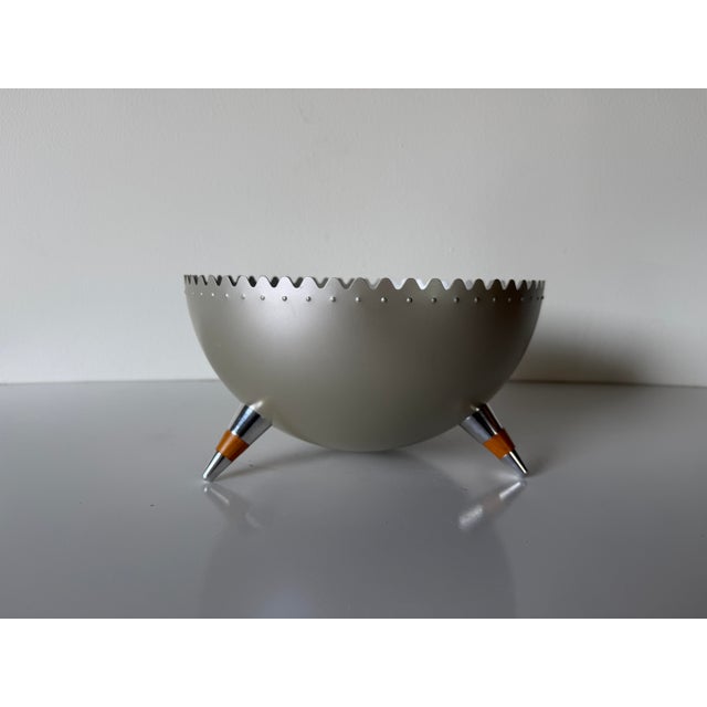 Striking “Chimu” bowl designed by Joanna Lyle for Alessi, Italy. This sculptural piece features a sleek satin silver-tone...