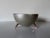 Striking “Chimu” bowl designed by Joanna Lyle for Alessi, Italy. This sculptural piece features a sleek satin silver-tone...