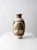This is a large vintage studio pottery vase. Signed by the artist, the hand-crafted vase features a speckled brown glaze...