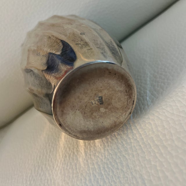 Small silver vase marked 925 with beautiful contemporary design. Opening is approximately 2 inches. Vase weighs 6 ounces....