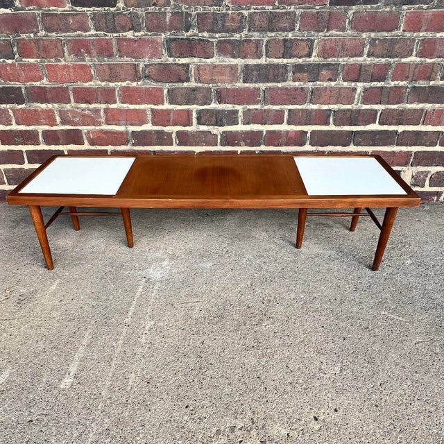 This is a vintage, mid-century coffee table designed by Merton Gershun for American of Martinsville. The main body is made...