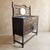 An antique Jacobean Revival-style buffet or sideboard with a tall mirrored gallery, richly grained dark-stained wood,...