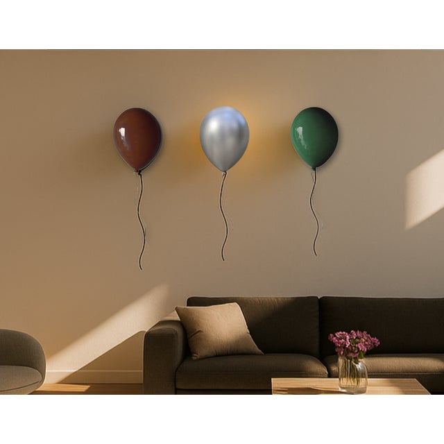 Add a unique sense of individuality into your space with this incredibly stylish silver balloon wall sculpture....
