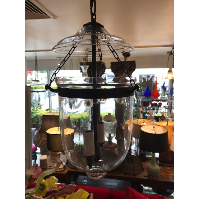 This is an antique glass lantern that has been restored and newly wired. It has all the original metal banding and small...