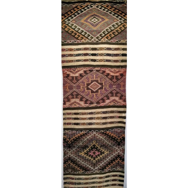 A beautiful vintage Moroccan runner from the mid-20th century, woven in a striking 'God's Eye' rhomboid medallion design —...