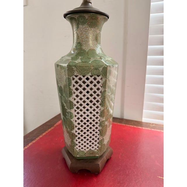 A beautifully decorated vintage Asian export porcelain table lamp featuring an all-over crackle glaze ground with vivid...