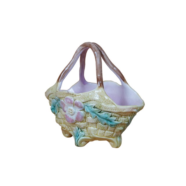 Antique Victorian English Majolica footed flower basket featuring a basketweave pattern with floral medallion and acanthus...