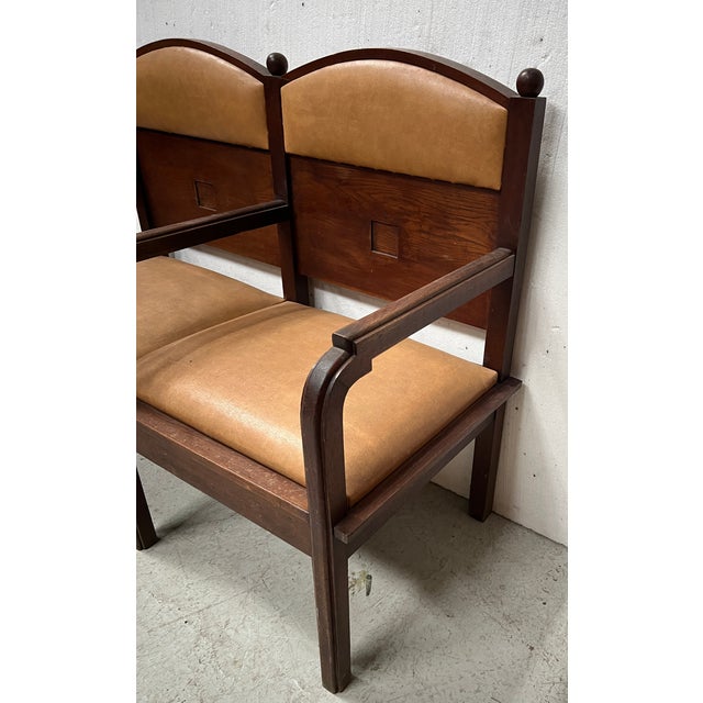 Art deco two-seater bench in solid mahogany a central armrest divides the bench in two seat and backrest in tan faux...