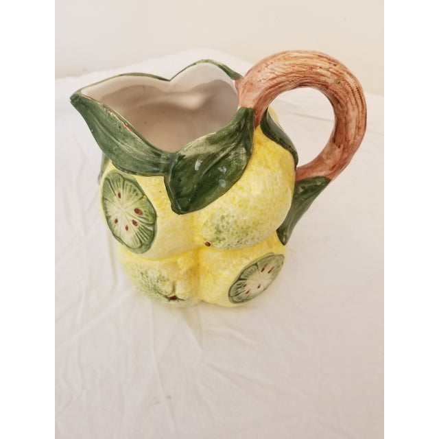 Charming Italian hand-painted lemon motif pitcher. Perfect for your summer table. Made in Basesno, Italy. Pitcher is...