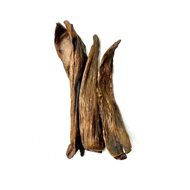 This is an abstract Flora based hand made, cast sculpture done by Seena Donneson an acclaimed woman artist. A textured...