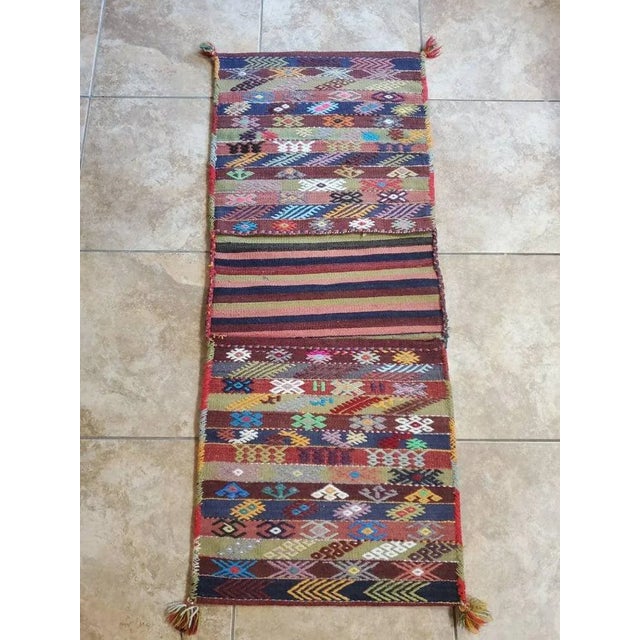 A wonderful old hand-woven wool kilim Turkish tribal saddle bag. A very nice example with lots of details, made with...