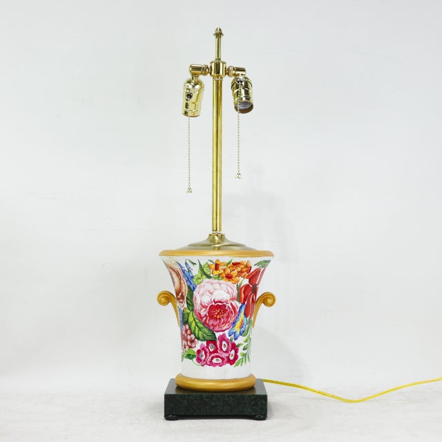 Bright and romantic, this pair of vintage wooden table lamps bursts with richly hand-painted florals, including vibrant...