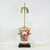 Bright and romantic, this pair of vintage wooden table lamps bursts with richly hand-painted florals, including vibrant...