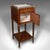 This is an antique bedside table. A French, walnut, marble and inlaid brass nightstand, dating to the early Victorian...