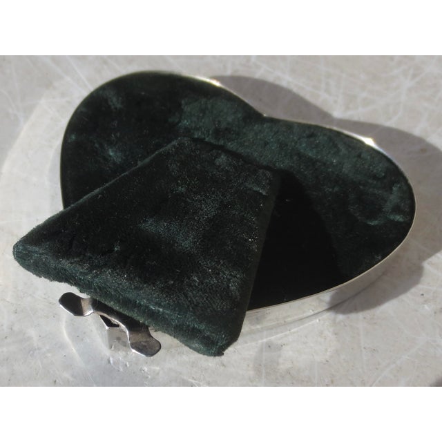 Sterling silver heart frame. Marked Sterling and 925. The measurements are 3" by 3". INV 64th.