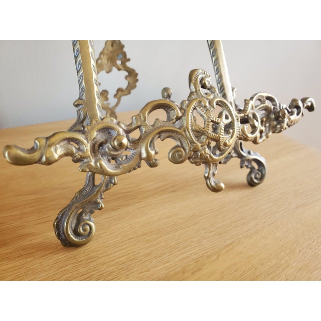 Elegant ornate Rococo style brass easel to display or books. Great for styling and a unique way to display art on a table...