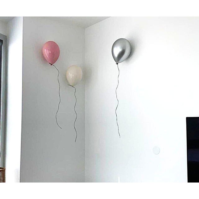 Ceramic Silver balloon wall sculpture designed as a jewel for your home. Handcrafted from clay, and coated with high...