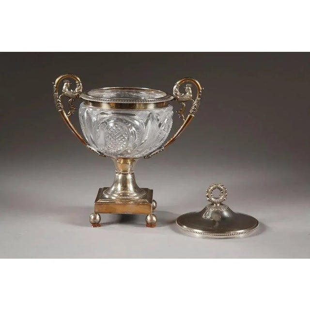 Elegant candy dish in creusot cut crystal and silver, decorated with foliage and petals. The high handles are embellished...