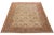 This room-sized rug features a stunning tan-beige foundation, adorned with intricate floral patterns in rust, green, and...