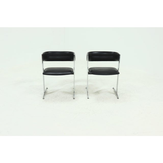 Pair of dining chairs by Sigmachair, manufactured in Italy during the 1970s. Characterised by clean lines and subtle...