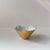Naturalistic expressionist bowl in white porcelain with gold-leaf glaze to its exterior. Designed by Textile/Fashion...