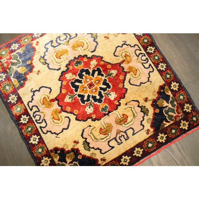 This is a beautiful antique handwoven silk Khotan rug from Xinjiang, Western China, measuring approximately 1'9" × 1'10"....