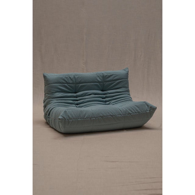 Iconic Togo two-seater sofa designed by Michel Ducaroy for Ligne Roset in 1973. A celebrated example of French modernist...