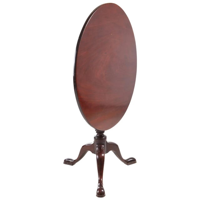 Fine quality antique 18th century Georgian mahogany tripod table boasting a delightful round Cuban mahogany tilt top. The...